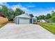 Charming blue home with a spacious concrete driveway and an attached garage at 3567 Farmfield Dr, Claremont, NC 28610
