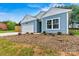 Close up of a light blue home with white trim and fresh landscaping at 3567 Farmfield Dr, Claremont, NC 28610