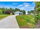 Well maintained home featuring a driveway, attached garage, manicured lawn, and lush landscaping at 3567 Farmfield Dr, Claremont, NC 28610