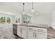 Granite kitchen island with sink and stainless dishwasher at 3567 Farmfield Dr, Claremont, NC 28610