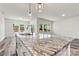 Granite kitchen island with sink and stylish pendant lighting at 3567 Farmfield Dr, Claremont, NC 28610
