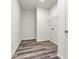 Laundry room with wood grain floors, white walls, and wire rack for storage at 3567 Farmfield Dr, Claremont, NC 28610