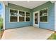 Covered back porch featuring multiple windows and a door to the backyard at 3567 Farmfield Dr, Claremont, NC 28610
