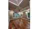 Spacious bedroom features a stylish coffered ceiling, beautiful hardwood floors, and large windows for ample natural light at 3733 Whitney Ne Dr, Hickory, NC 28601