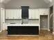 Modern kitchen featuring a large island, stylish cabinetry, and stainless steel appliances, perfect for cooking at 3733 Whitney Ne Dr, Hickory, NC 28601