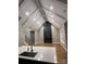 An expansive living room offers hardwood floors, a modern fireplace, and vaulted ceilings, adjacent to the kitchen at 3733 Whitney Ne Dr, Hickory, NC 28601