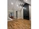 A spacious living room boasts vaulted ceilings, hardwood floors, and a modern fireplace, with a staircase nearby at 3733 Whitney Ne Dr, Hickory, NC 28601