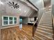 An expansive open-concept living space featuring hardwood floors, modern kitchen, and staircase, perfect for modern living at 3733 Whitney Ne Dr, Hickory, NC 28601