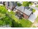 Brick home featuring a deck with pergola and large backyard and green trees at 3748 Tea Olive Rd, Gastonia, NC 28056