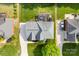 Aerial view of a home showcasing the roof, backyard, and surrounding landscape at 3748 Tea Olive Rd, Gastonia, NC 28056