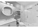 This bathroom has a white vanity, tile shower, and decorative mirror at 3748 Tea Olive Rd, Gastonia, NC 28056