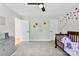 This bedroom features butterfly decals, carpet floors, and a ceiling fan at 3748 Tea Olive Rd, Gastonia, NC 28056
