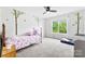 This bedroom includes carpet, tree decals, and lots of light from the large window at 3748 Tea Olive Rd, Gastonia, NC 28056