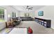 This spacious bonus room has carpet floors, natural light, and a ceiling fan at 3748 Tea Olive Rd, Gastonia, NC 28056