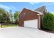 Charming brick home featuring an attached garage and a large paved driveway at 3748 Tea Olive Rd, Gastonia, NC 28056