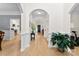 Inviting hallway with hardwood floors, archways, and decorative plants at 3748 Tea Olive Rd, Gastonia, NC 28056