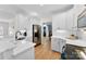 Bright kitchen featuring white cabinets, stainless steel appliances, marble countertops and hardwood floors at 3748 Tea Olive Rd, Gastonia, NC 28056
