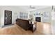 Cozy living room featuring a fireplace, hardwood floors, and plenty of natural light at 3748 Tea Olive Rd, Gastonia, NC 28056