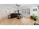 Bright living room with hardwood floors, a ceiling fan, and lots of natural light at 3748 Tea Olive Rd, Gastonia, NC 28056