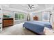 Spacious bedroom with carpeted floors and a tray ceiling at 3748 Tea Olive Rd, Gastonia, NC 28056