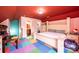 Bright upstairs bedroom with a double bed and colorful flooring near the bathroom at 3837 1St Street Nw Ln, Hickory, NC 28601