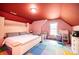 Spacious upstairs bedroom features colorful flooring and walls and a bright window at 3837 1St Street Nw Ln, Hickory, NC 28601