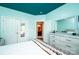 Well-lit bedroom with a large closet, a view of the main bathroom, light blue walls, and light-colored wood floors at 3837 1St Street Nw Ln, Hickory, NC 28601