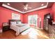 Cozy bedroom with tray ceilings, wood floors, and ample natural light at 3837 1St Street Nw Ln, Hickory, NC 28601