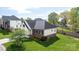 Well-maintained home featuring a lush green lawn, brick accents, and a serene backyard setting at 3837 1St Street Nw Ln, Hickory, NC 28601