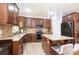Updated kitchen features granite counters, tile backsplash, and dark wood cabinets at 3837 1St Street Nw Ln, Hickory, NC 28601