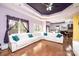 Open-concept living space with hardwood floors, recessed lights, and comfortable white sectional seating at 3837 1St Street Nw Ln, Hickory, NC 28601