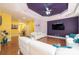 Modern living room featuring hardwood floors, recessed lights, and purple accent walls at 3837 1St Street Nw Ln, Hickory, NC 28601