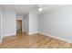 Neutral bedroom with ceiling fan features beautiful hardwood floors and access to an attached bathroom at 400 N Church St # 413, Charlotte, NC 28202