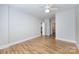 This neutral bedroom features gorgeous hardwood floors and doors leading to a bathroom and closet at 400 N Church St # 413, Charlotte, NC 28202