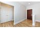 Entryway with wood flooring and white trim at 400 N Church St # 413, Charlotte, NC 28202