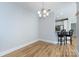 Living room with breakfast bar and neutral paint at 400 N Church St # 413, Charlotte, NC 28202