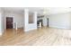 Open-concept living space with wood floors and neutral paint palette at 400 N Church St # 413, Charlotte, NC 28202