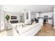 Bright, open-concept living area features hardwood floors and a modern kitchen with stainless steel appliances at 400 N Church St # 413, Charlotte, NC 28202