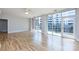 Spacious living room with hardwood floors and sliding glass doors leading to a balcony at 400 N Church St # 413, Charlotte, NC 28202