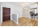 Open-concept living room with wood floors at 400 N Church St # 413, Charlotte, NC 28202