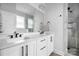 Contemporary bathroom with double vanity, and glass-enclosed shower, and modern fixtures at 4002 Tundra Rd, Charlotte, NC 28203