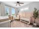 Cozy Bedroom with crib, rocking chair, and soft, natural light at 4002 Tundra Rd, Charlotte, NC 28203