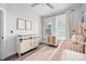 Charming Bedroom with a changing table, crib, and windows for plenty of natural light at 4002 Tundra Rd, Charlotte, NC 28203