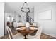 Elegant dining room featuring a round table set and stylish chandelier at 4002 Tundra Rd, Charlotte, NC 28203