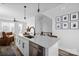 Modern kitchen island boasts stainless steel appliances and a sleek white countertop at 4002 Tundra Rd, Charlotte, NC 28203