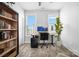 Bright office space with dual windows, modern desk setup, and stylish bookcase at 4002 Tundra Rd, Charlotte, NC 28203