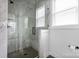 Stylish bathroom features a glass-enclosed shower with marble-look tiles and sleek fixtures at 4002 Tundra Rd, Charlotte, NC 28203