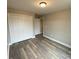 Bedroom features a closet and wood-look flooring at 4172 Saltwood Dr, Hickory, NC 28602