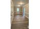 Entryway with white door, white trim and wood-look floors at 4172 Saltwood Dr, Hickory, NC 28602