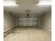 Empty garage with overhead door and lighting at 4172 Saltwood Dr, Hickory, NC 28602